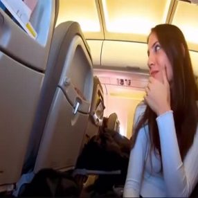 Naughty girl swallows on a crowded plane