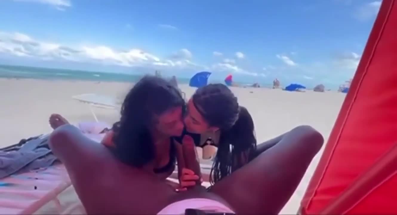 BBC sucked by two hotties at public beach